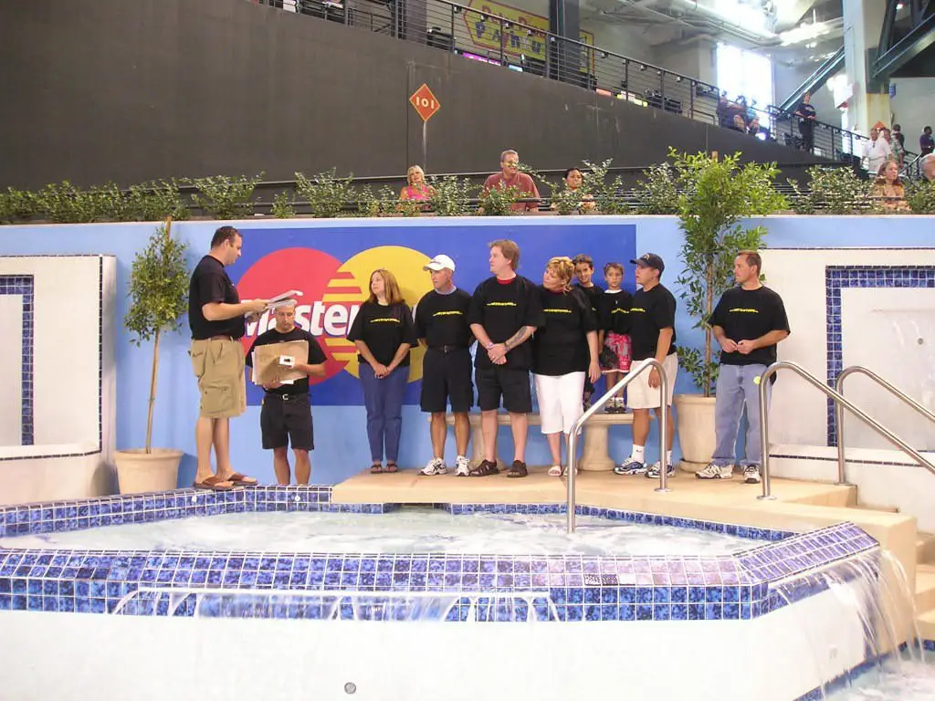 Team Standing with the original diamond back swimming pool before remodel