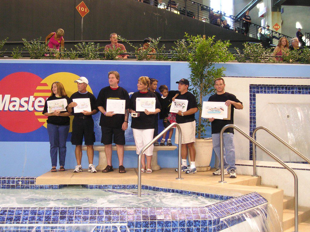 Team holding up new design for arizona diamond back pool remodel