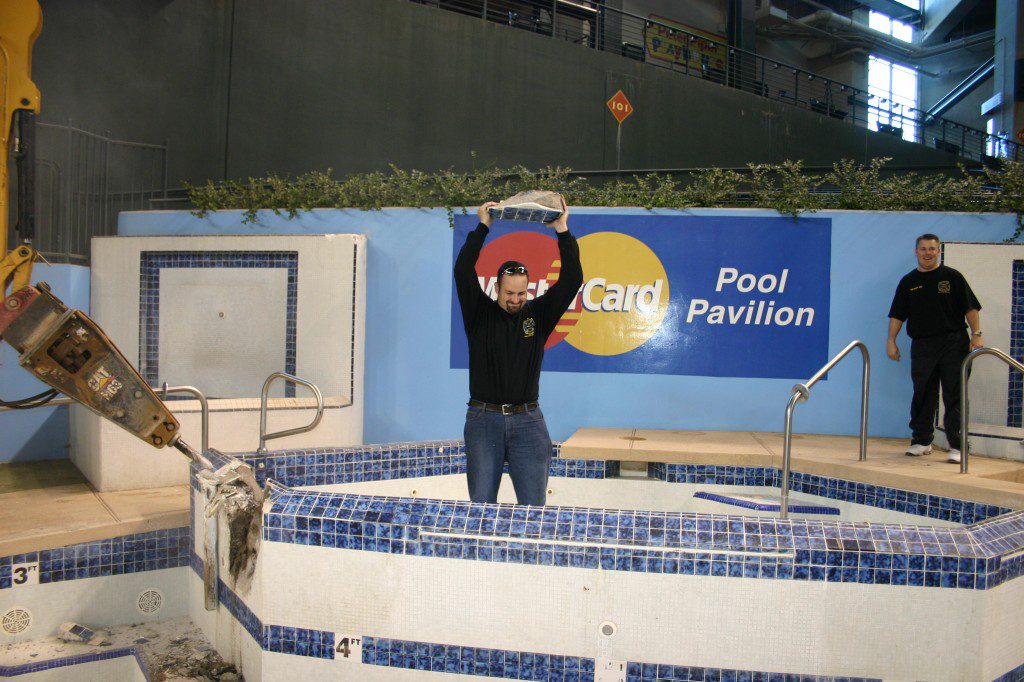 Owner of We Fix Ugly Pools, Brian, helping remove swimming pool for Arizona Diamond Backs