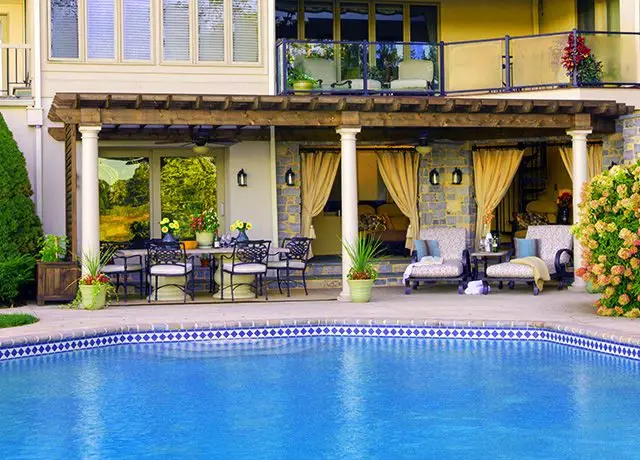 Large rounded column pergola with custom swimming pool in arizona