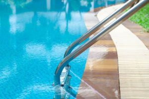Close up of swimming pool edge showing the infinity style