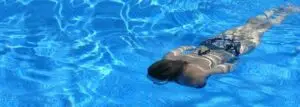 Woman swimming in a lap Swimming Pool