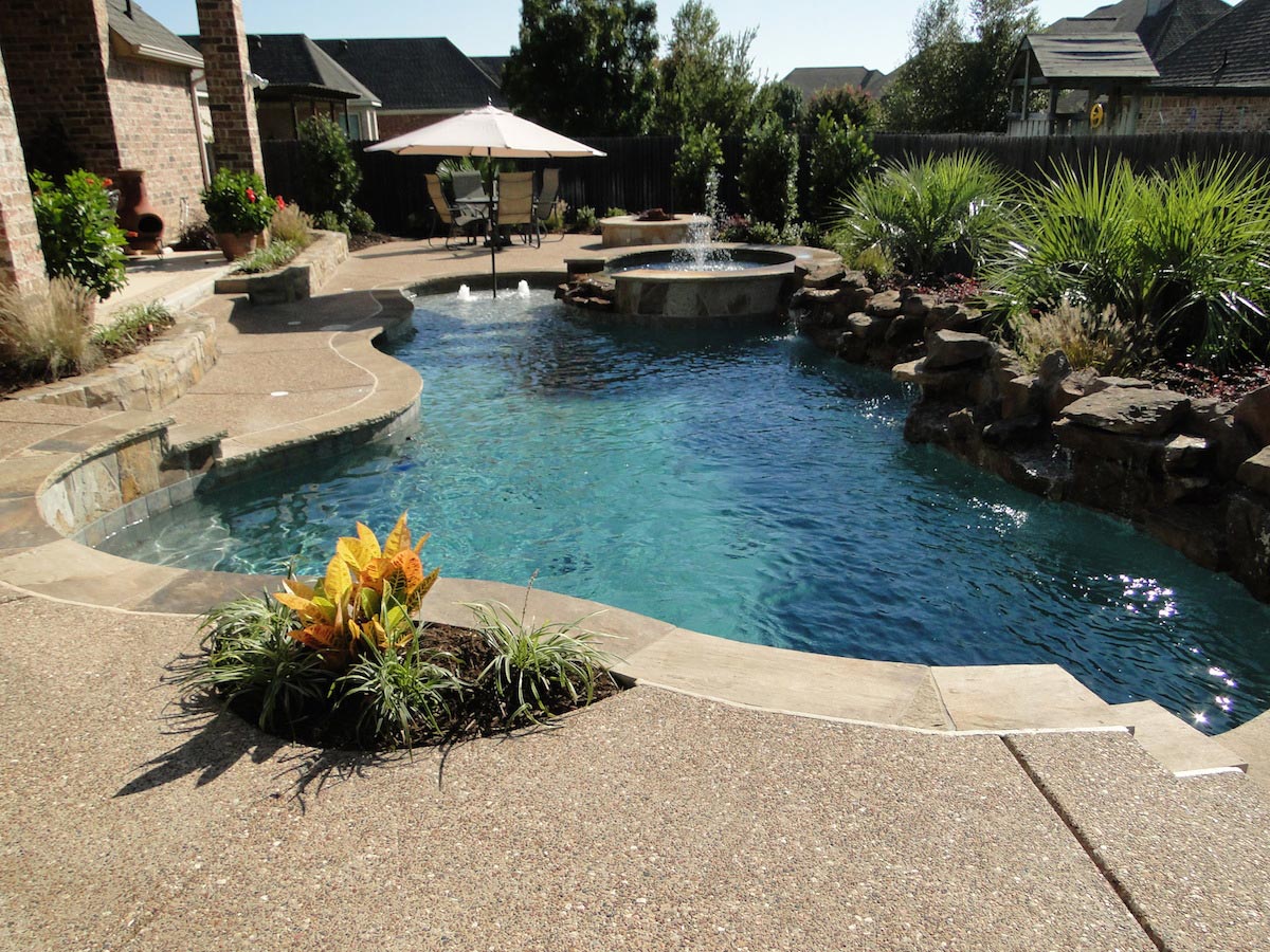 Custom free style swimming pool with rock and water features