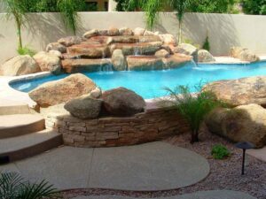 Rock Waterfall in a Free Form Swimming Pool Design