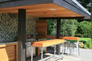Modern outdoor kitchen with mobile island