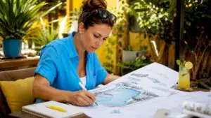 Architect reviewing swim-up pool bar plans