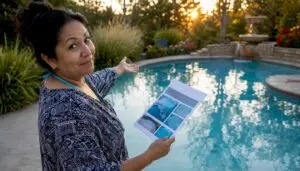 Homeowner reviewing pool condition report poolside
