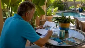 Homeowner reviewing pool remodel quotes