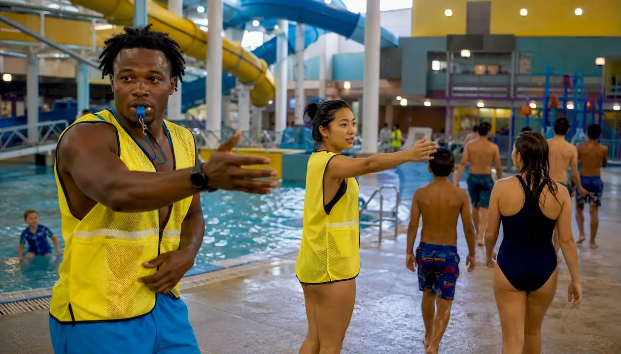 Pool staff directing swimmers to exit during thunder
