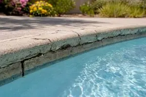 Cracked pool coping edge close-up