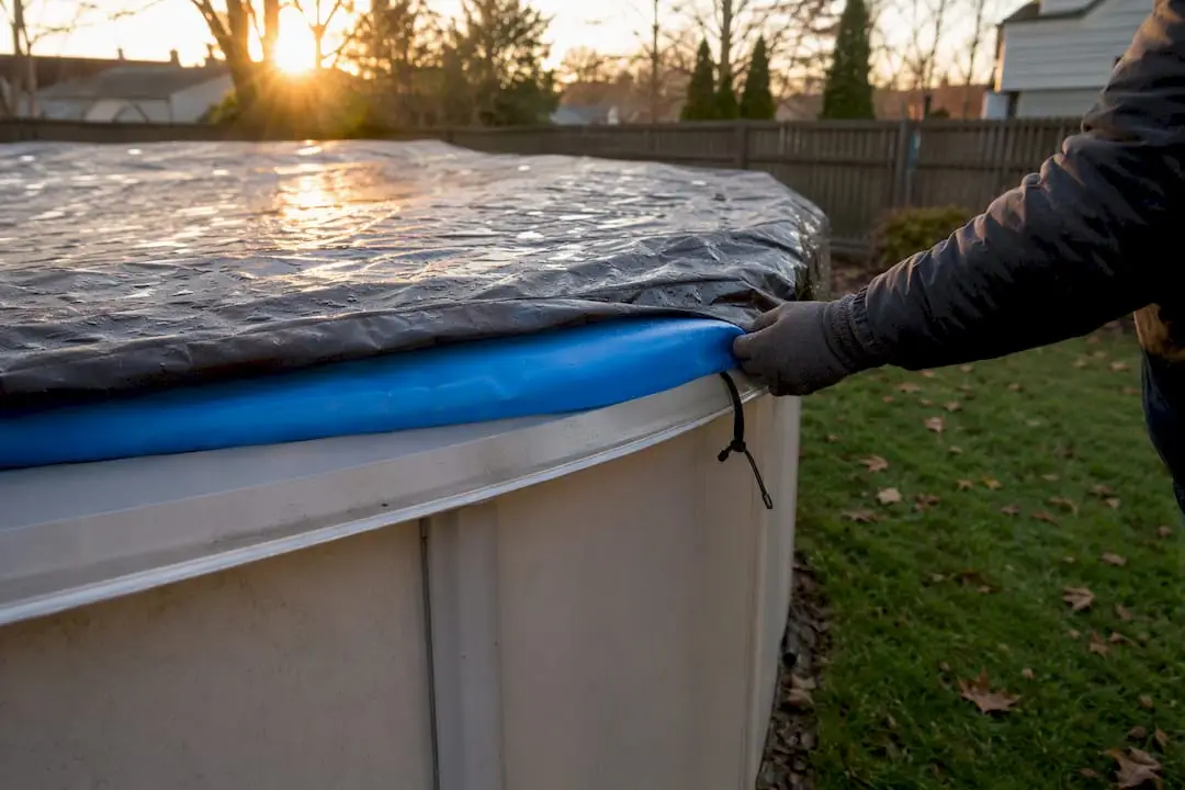 Installing air pillow under above-ground pool cover