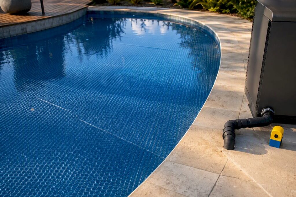 Pool cover beside partial heater equipment